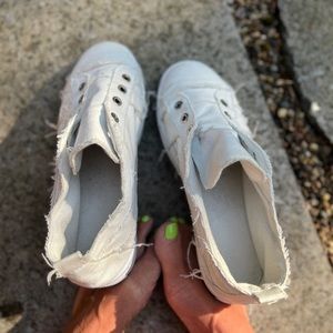 Worn White Sneakers